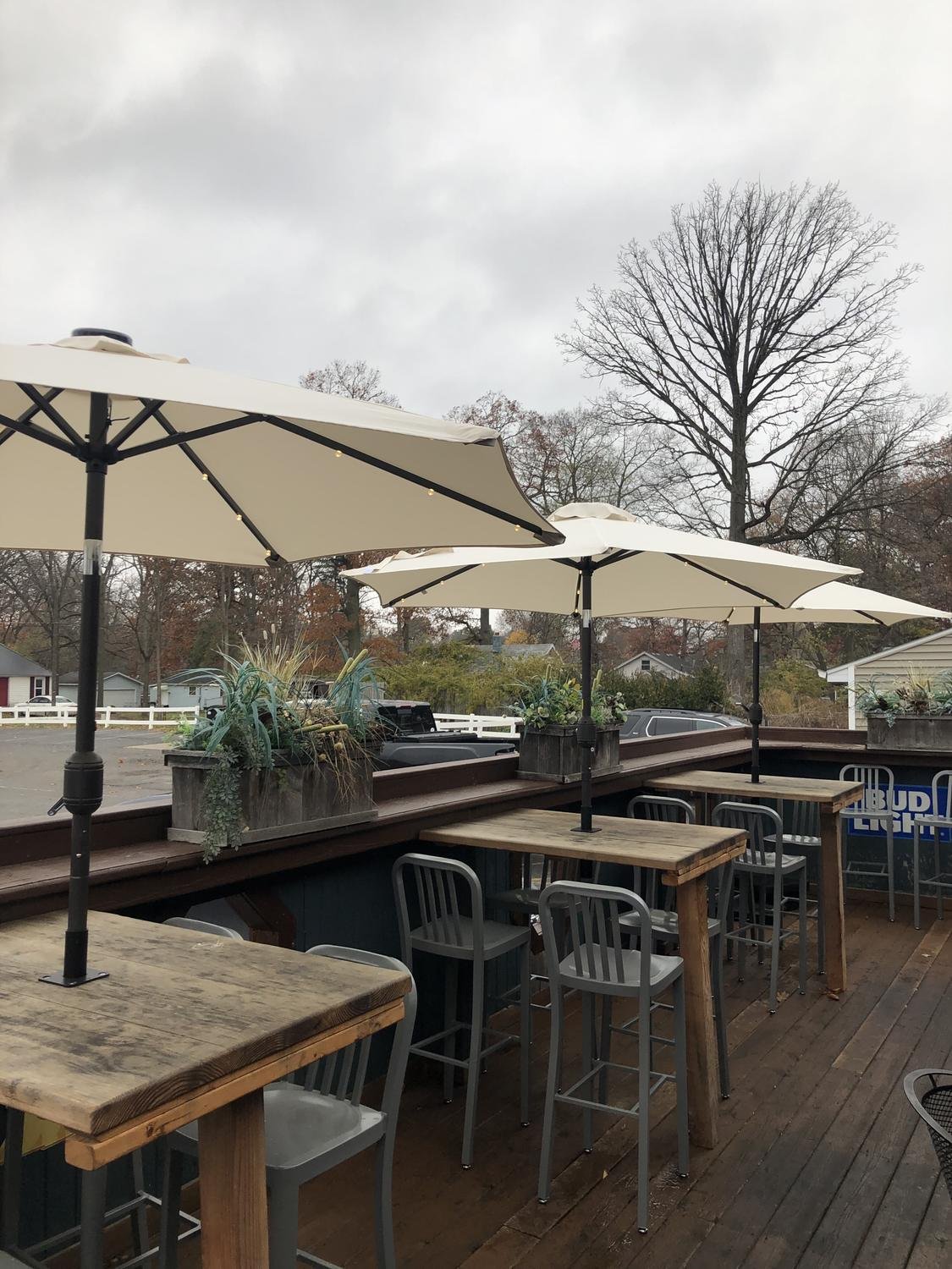 Restaurant patio with umbrellas on high-top tables